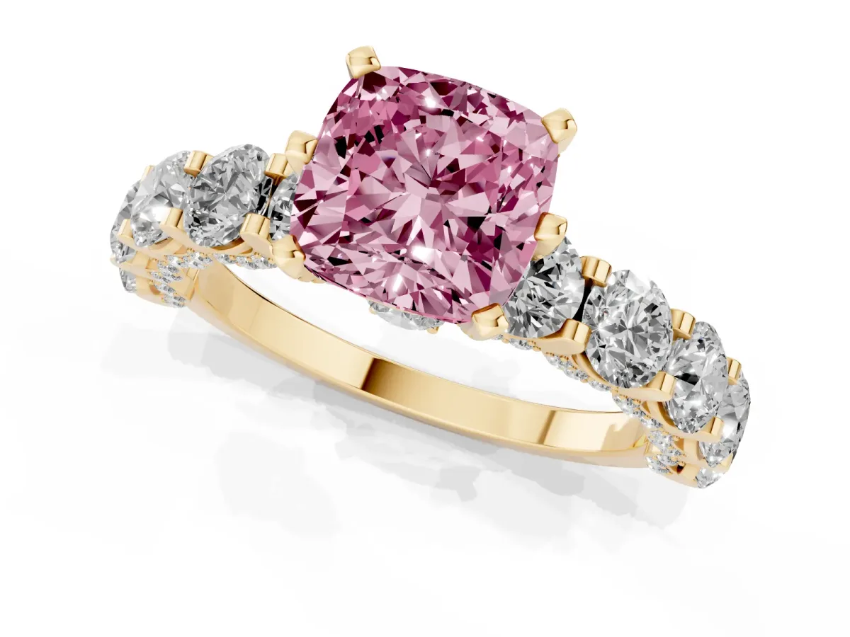 Fancy Pink Cushion Cut Diamond Side Stone Engagement Ring with Four-Prong Setting Yellow gold