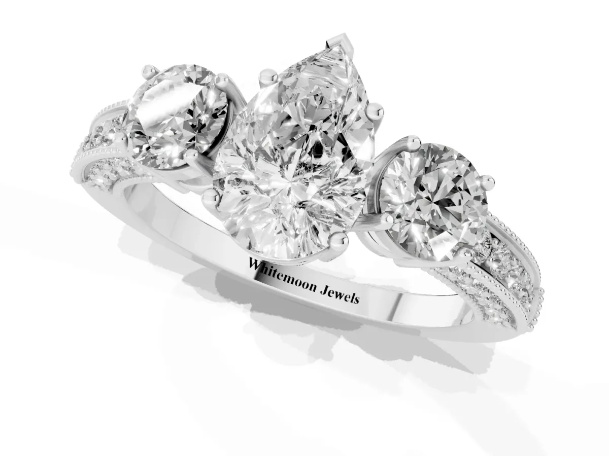 Pear Cut Three-Stone Diamond Ring with Pavé Band and Four-Prong Setting Silver
