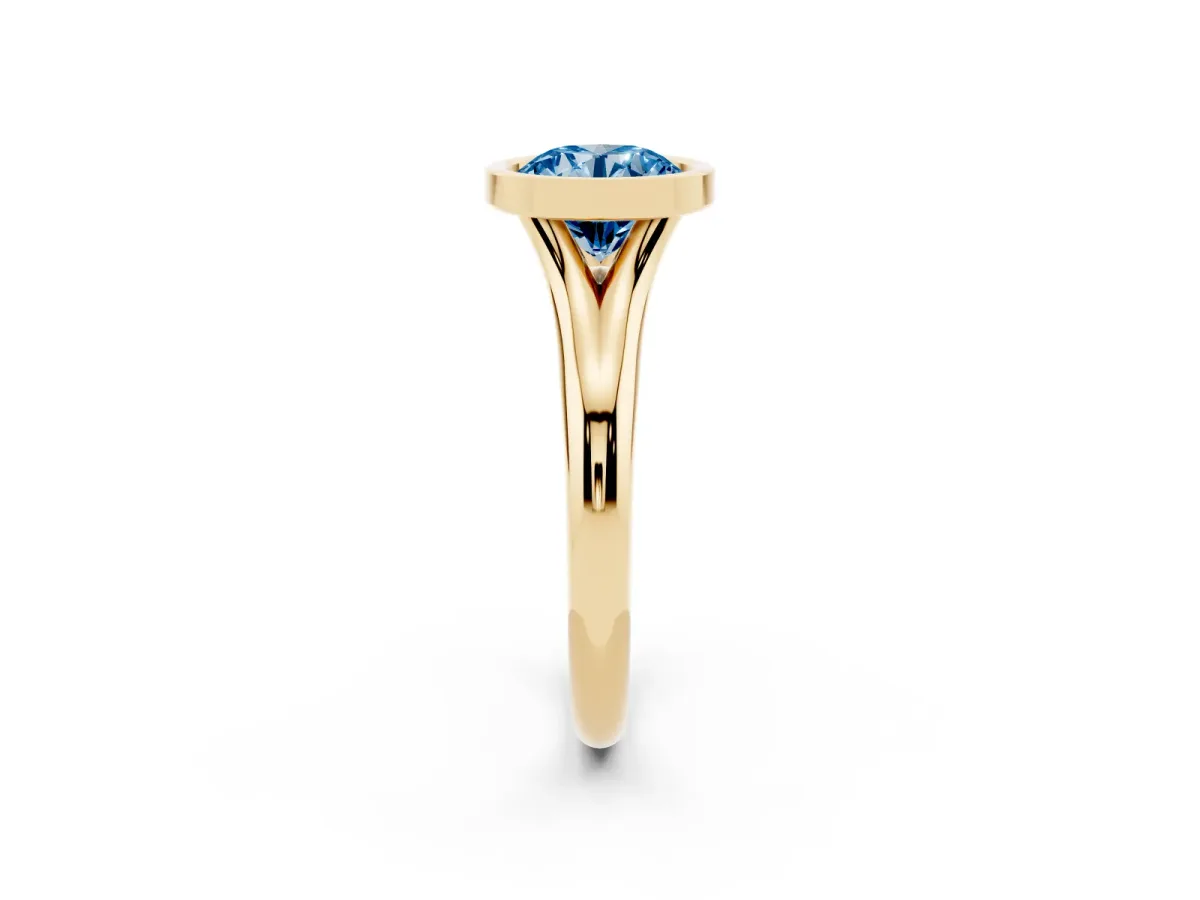 Fancy Blue Bezel Set Round Cut Solitaire Diamond Ring with Smooth Band Yellow gold