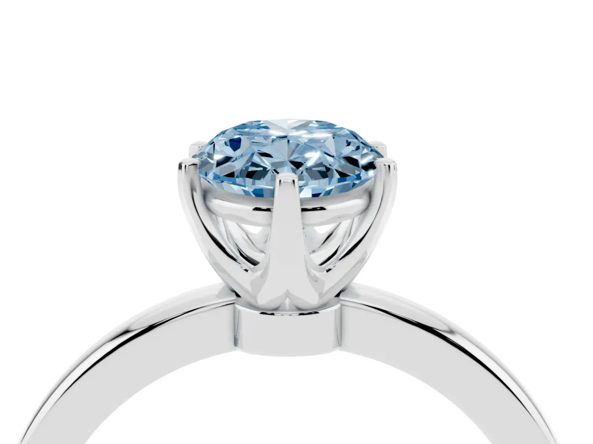 Fancy Blue Oval Cut Solitaire Diamond Ring with Six-Prong Setting on a Classic Band Silver