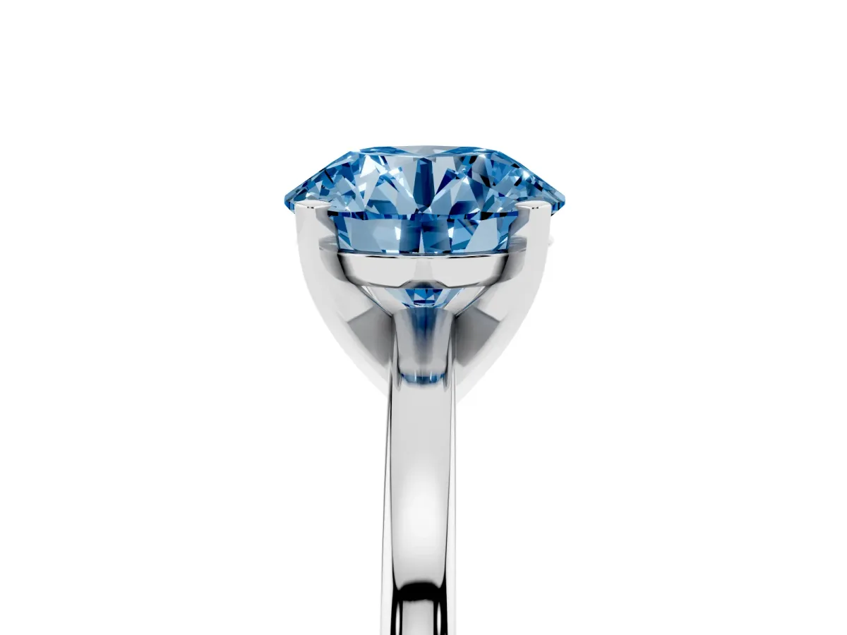 Fancy Blue Round Cut Solitaire Diamond Engagement Ring with Four-Prong Setting on a Classic Band Silver