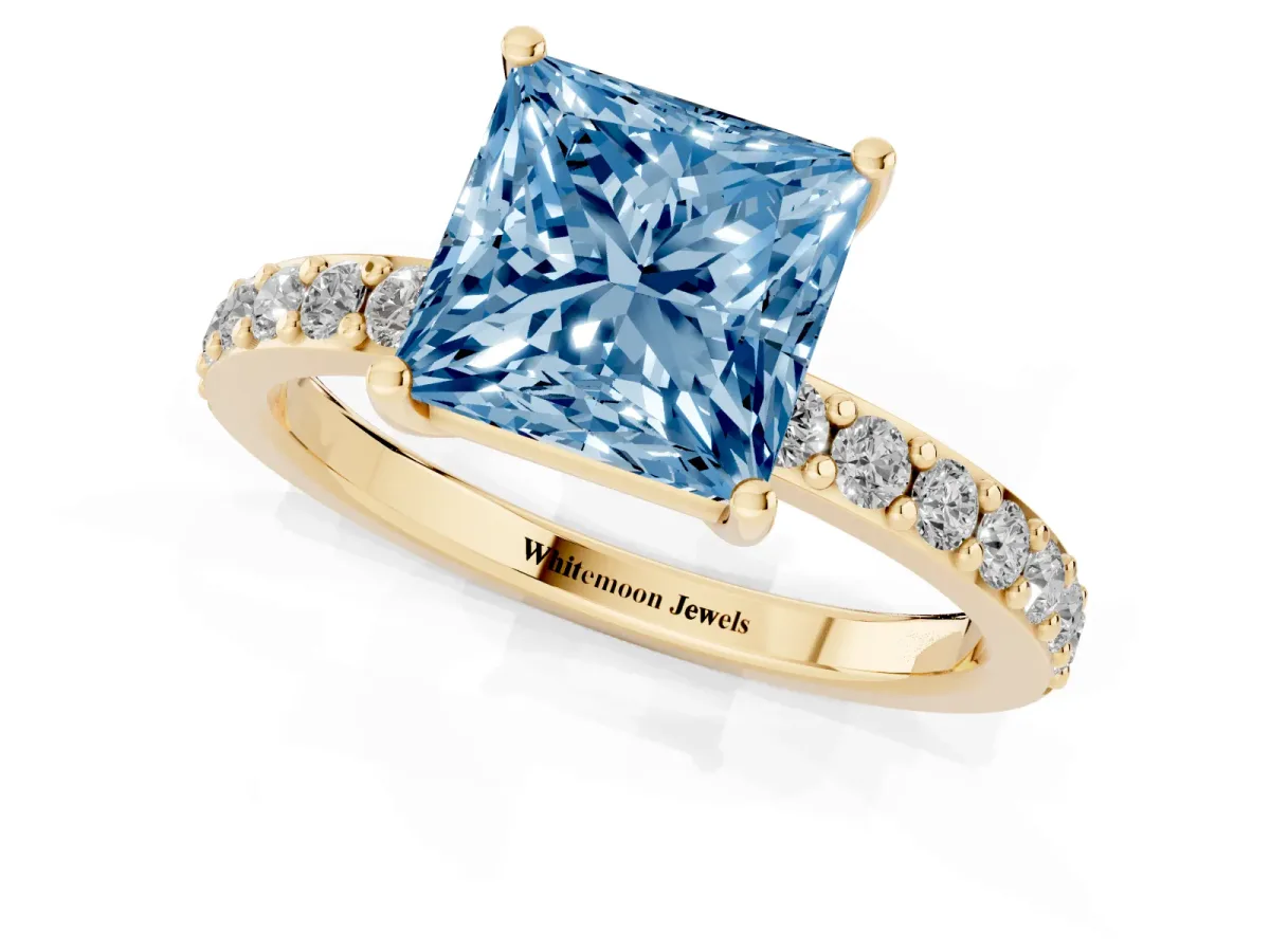 Fancy Blue Princess Cut Cut Diamond Solitaire with Pave Band and Four-Prong Setting Yellow gold