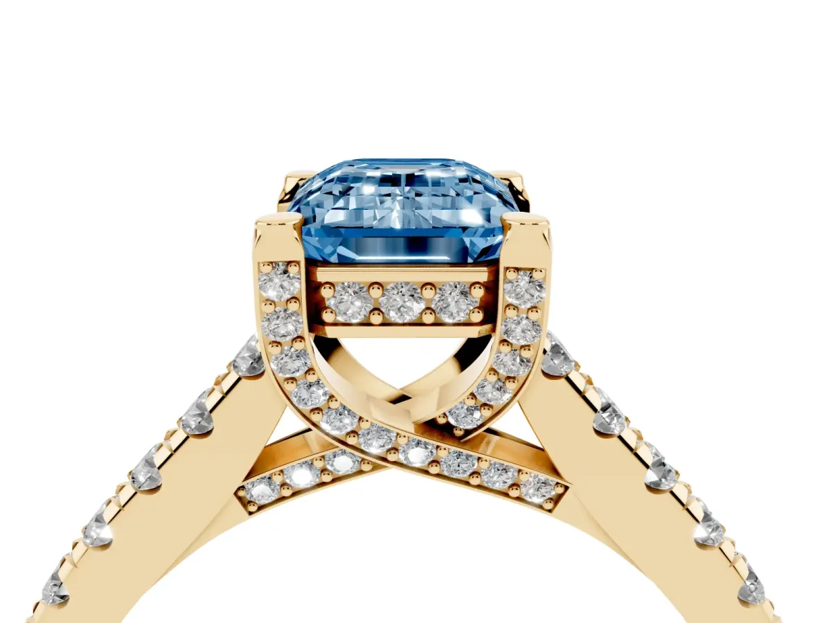 Fancy Blue Emerald Cut Brilliant Diamond Solitaire with Pavé Band and Four-Prong Setting Yellow gold