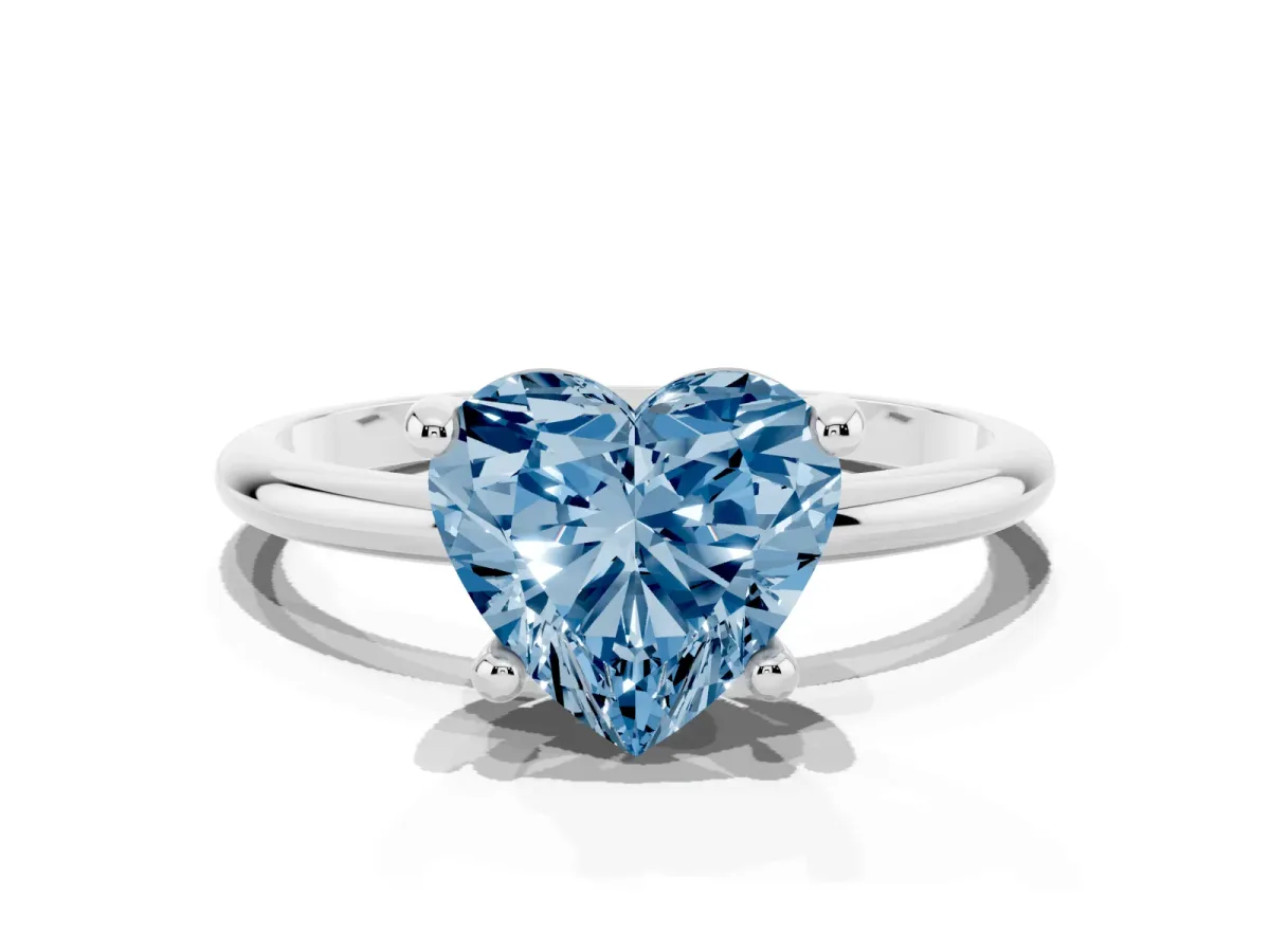 Fancy Blue Heart Cut Solitaire Diamond Ring with 4-Prong Setting on a Classic Band Silver