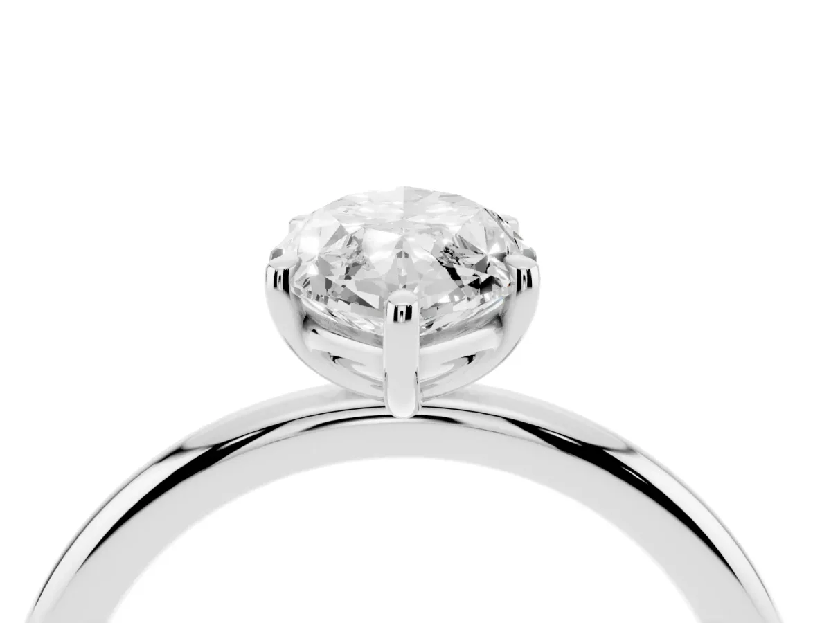 Oval Cut Solitaire Diamond Ring with Four-Prong Setting on a Plain Band Platinum