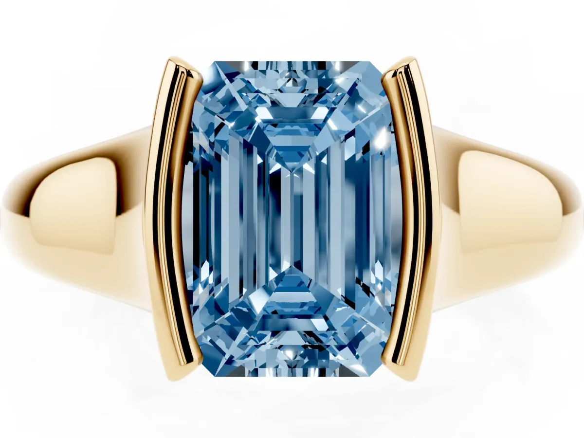 Fancy Blue Emerald Cut Solitaire Tension Set Diamond Ring with Split Shank Band Yellow gold