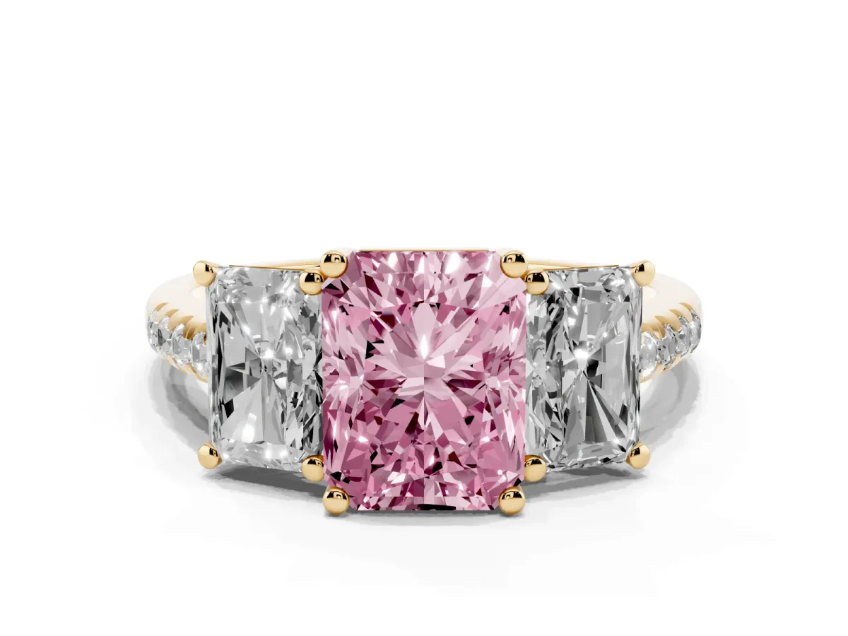 Fancy Pink Three-Stone Radiant Cut Diamond Ring with Round Pavé Band and Prong Setting Yellow gold