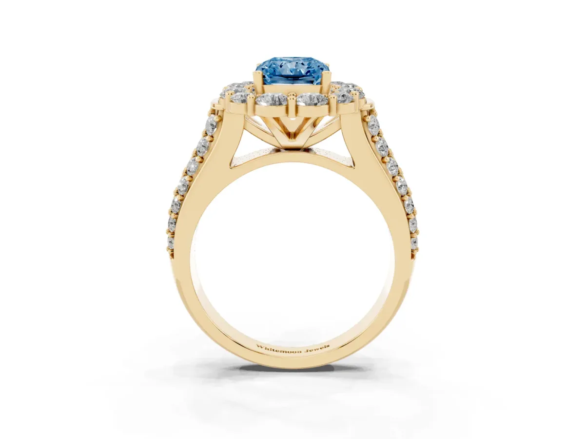 Fancy Blue Radiant Cut Halo Diamond Engagement Ring with Split Shank and Prong Setting Yellow gold