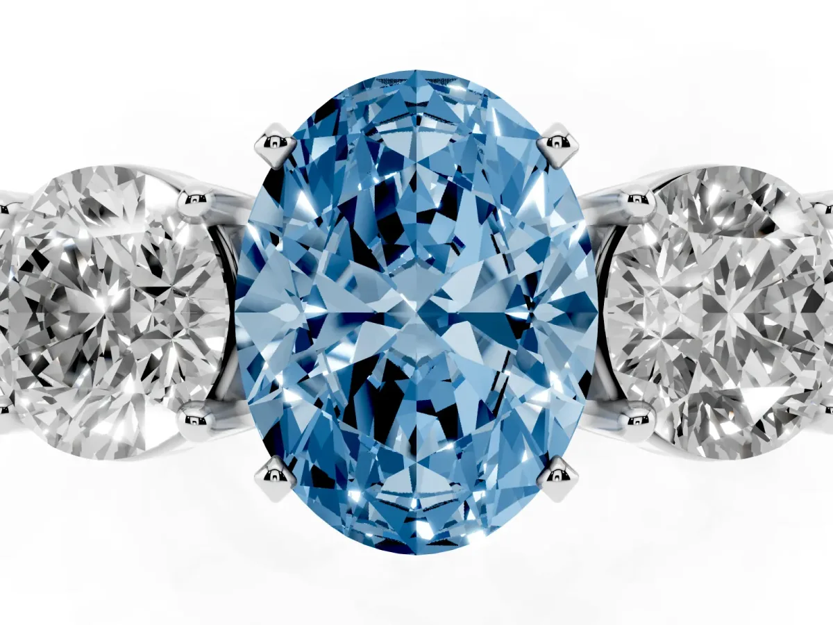 Fancy Blue Three-Stone Oval Cut Diamond Ring with Round Side Stones, Classic Band, and Four-Prong Setting White gold