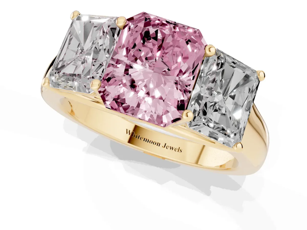 Fancy Pink Radiant Cut Three-Stone Diamond Ring with Prong Setting on a Classic Band Yellow gold