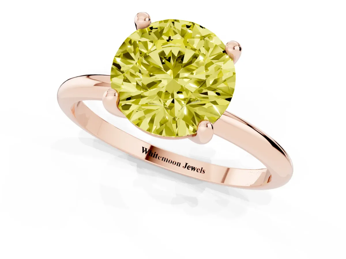 Fancy Yellow Round Cut Solitaire Diamond Ring with 4-Prong Setting on a Classic Band Rose gold