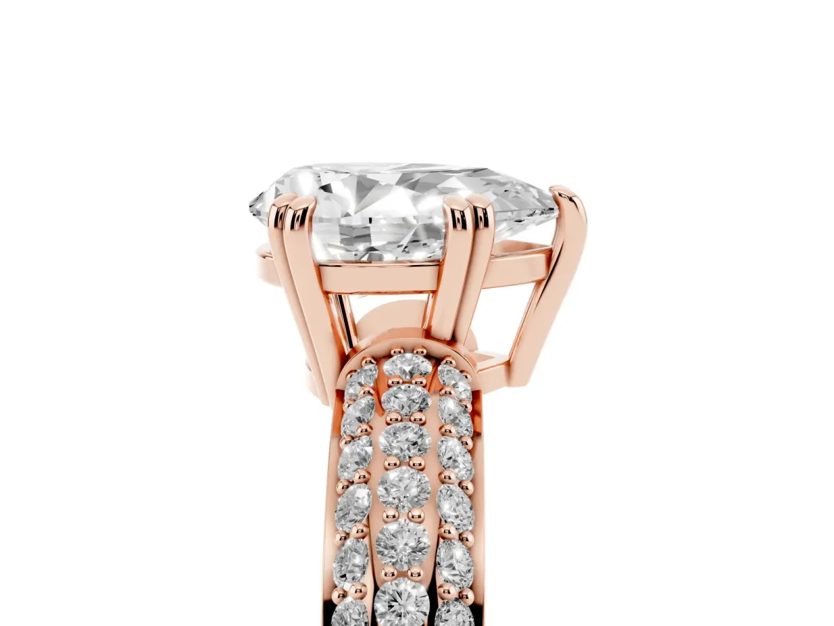 Pear Cut Diamond Solitaire Ring with Multi-Row Round Pavé Band and Prong Setting Rose gold
