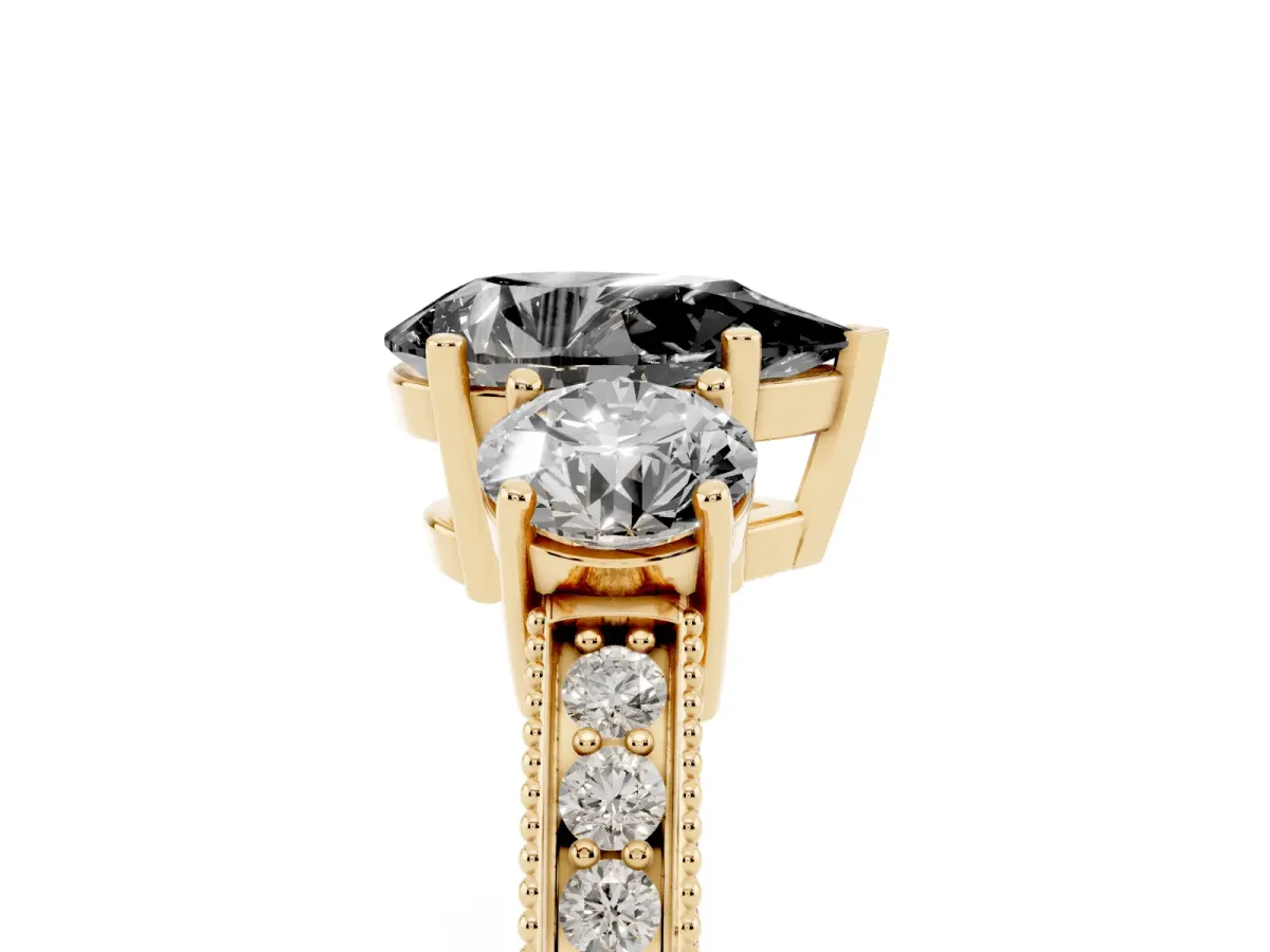 Fancy Black Pear Cut Three-Stone Diamond Ring with Pavé Band and Four-Prong Setting Yellow gold