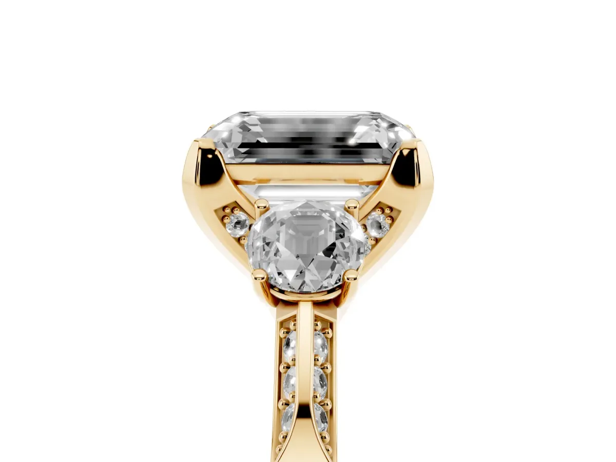 Fancy Black Emerald Cut Brilliant Three-Stone Diamond Ring with Pavé Band and Four-Prong Setting Yellow gold