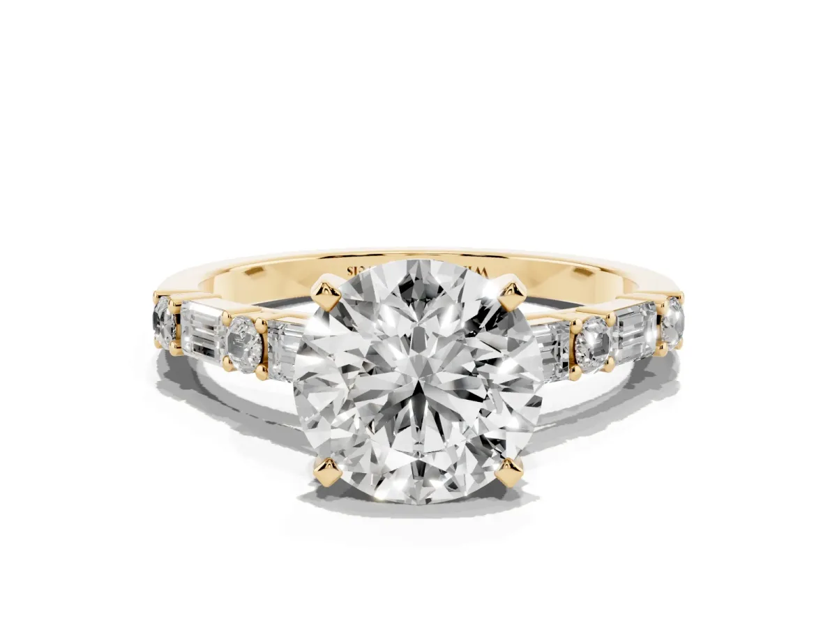Round Cut Diamond Solitaire with Side Baguettes and Channel Set Band Yellow gold