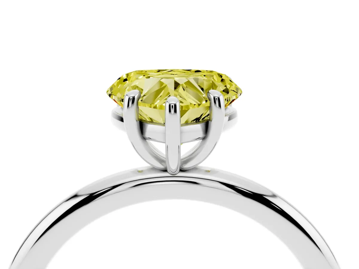 Fancy Yellow Heart Cut Solitaire Diamond Ring with Four-Prong Setting on a Plain Band Platinum