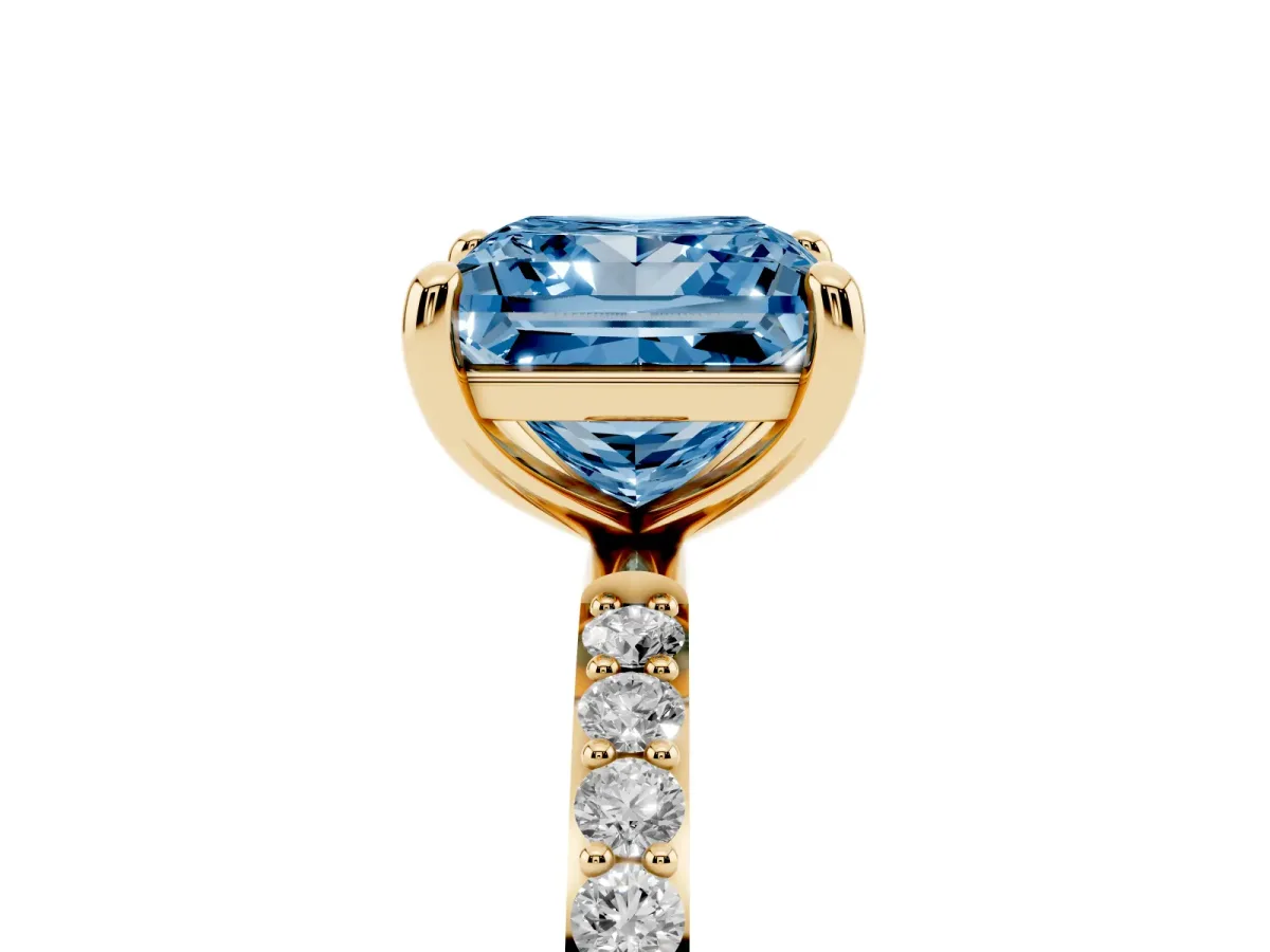 Fancy Blue Princess Cut Diamond Solitaire Ring with Round Pavé Band and Prong Setting Yellow gold