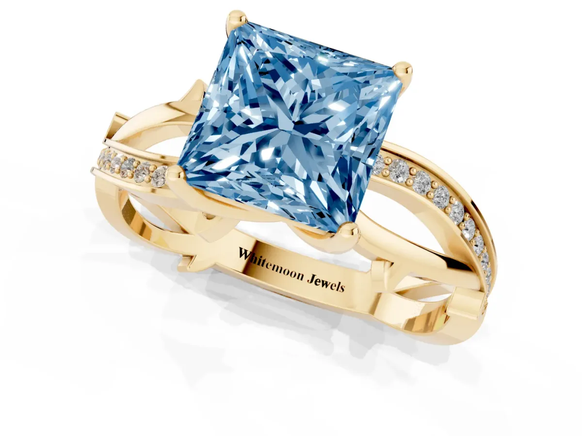 Fancy Blue Princess Cut Solitaire Twist Band with Pavé Accents and Four-Prong Setting Yellow gold