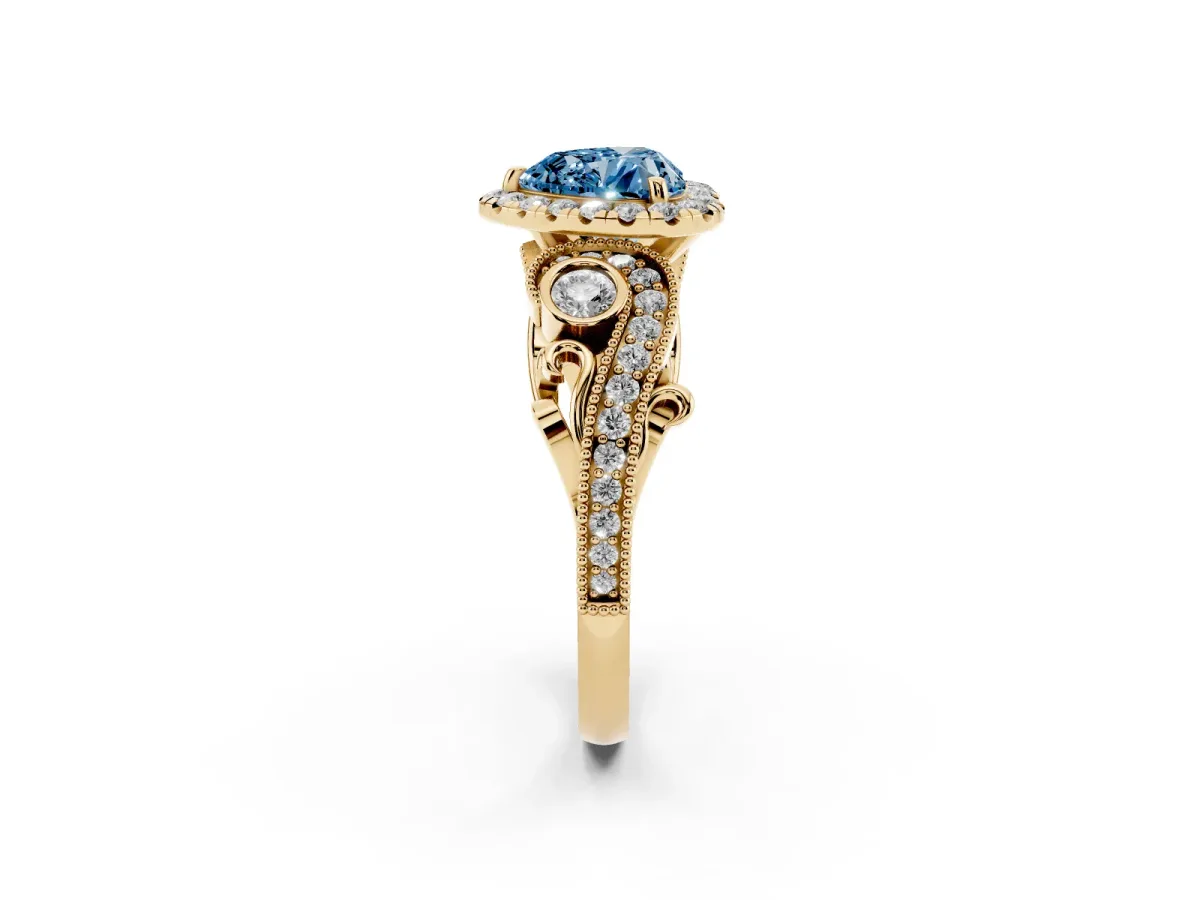 Fancy Blue Heart Cut Halo Diamond Ring with Milgrain and Bezel Accents on a Split Shank Band Yellow gold