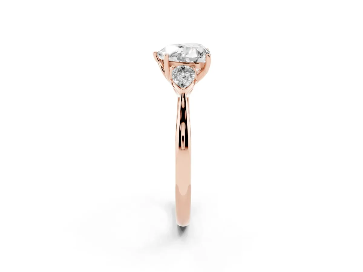 Three-Stone Heart Cut Diamond Ring with Pear Side Stones in Four-Prong Setting Rose gold