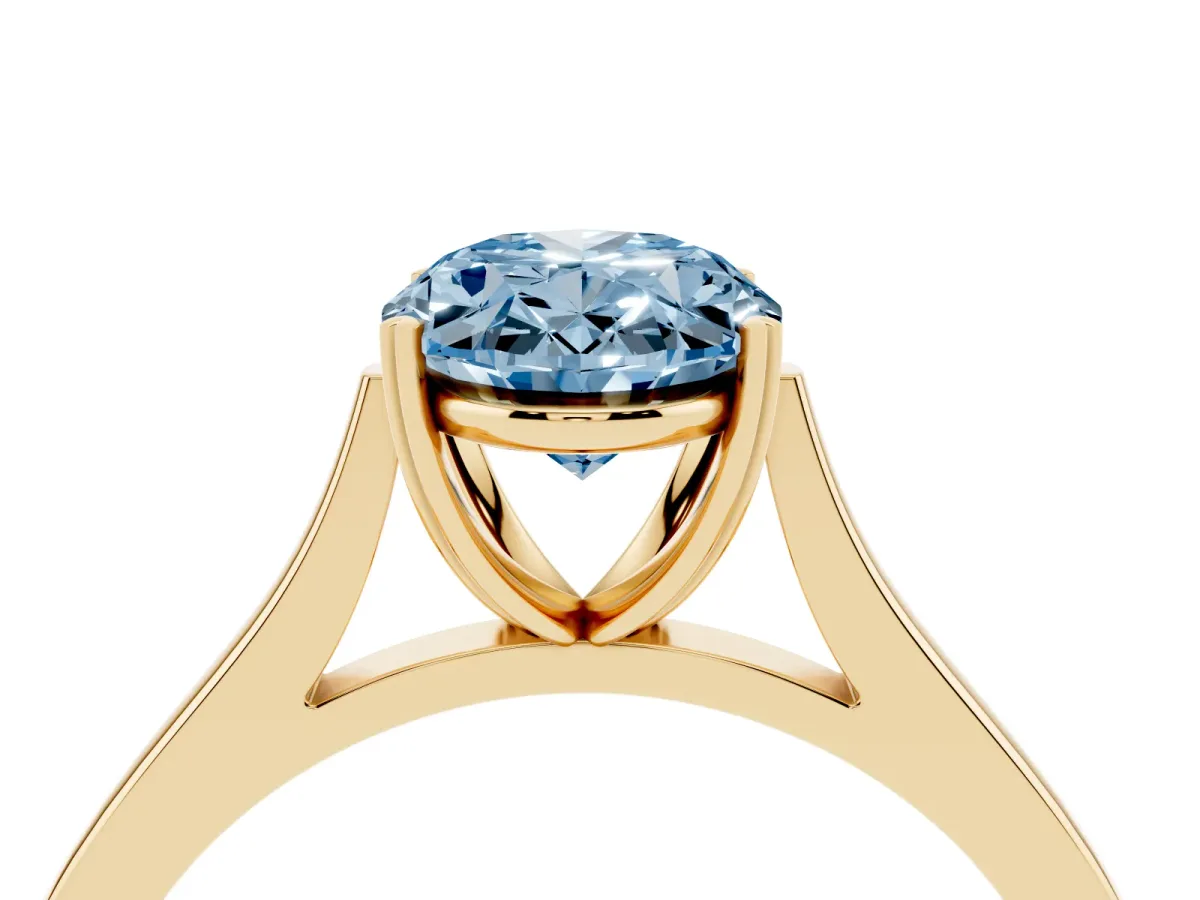 Fancy Blue Oval Cut Solitaire Heart Prong Engagement Ring with Tapered Band Yellow gold