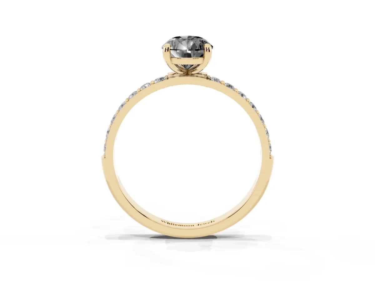 Fancy Black Pear Cut Diamond Solitaire Ring with Round Pavé Band and Prong Setting Yellow gold