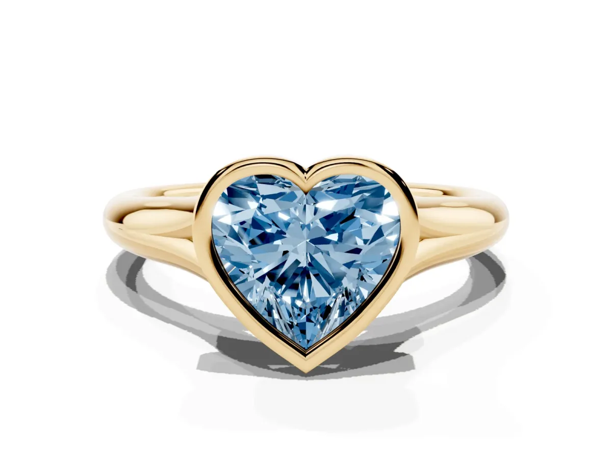 Fancy Blue Bezel Set Heart Cut Solitaire Diamond Ring with Smooth Band Yellow gold