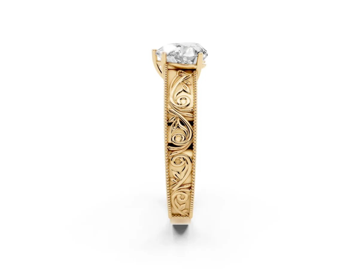 Heart Cut Diamond Solitaire Ring with Engraved Band and Four-Prong Setting Yellow gold