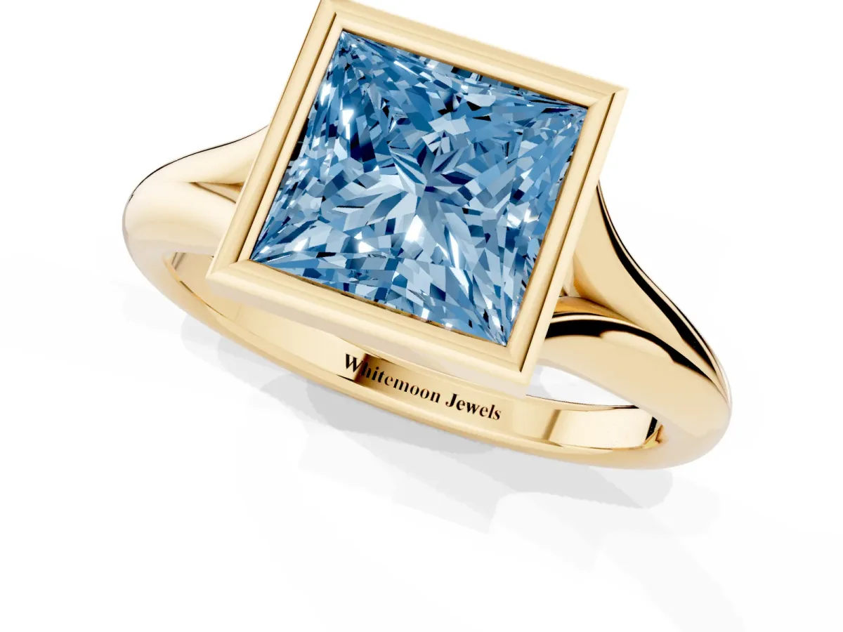 Fancy Blue Bezel Set Princess Cut Solitaire Diamond Ring with Smooth Band Yellow gold