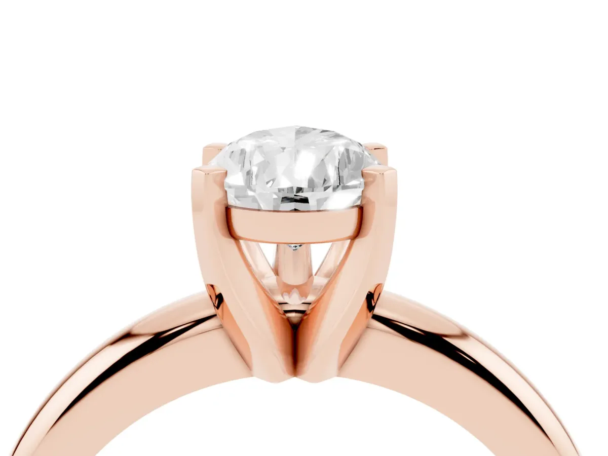 Pear Cut Diamond Solitaire Engagement Ring with Round Band and Four-Prong Setting Rose gold