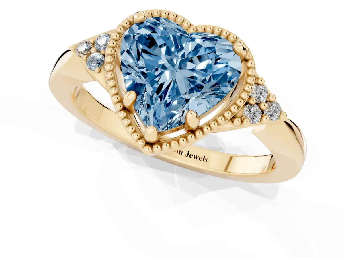 Fancy Blue Milgrain Heart Cut Cut Diamond Ring with Tapered Pave Band and Four Prong Setting Yellow gold