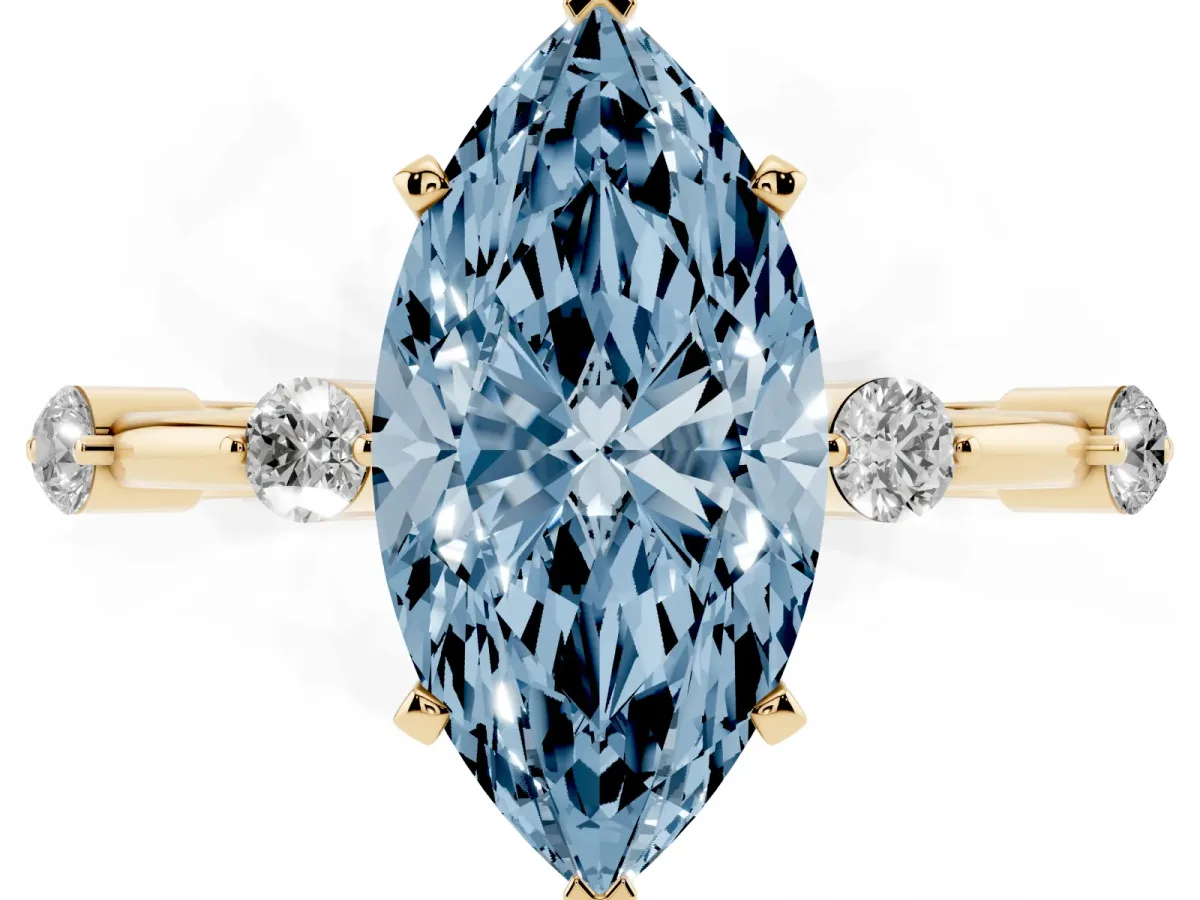 Fancy Blue Marquise Cut Solitaire Diamond Ring with Bezel Set Side Stones and Prong Setting Yellow gold