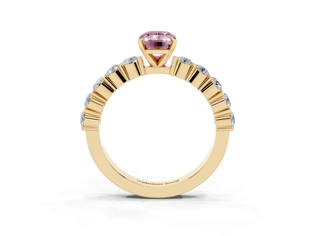 Fancy Pink Emerald Cut Diamond Solitaire Ring with Shared Prong Round Side Stones Yellow gold
