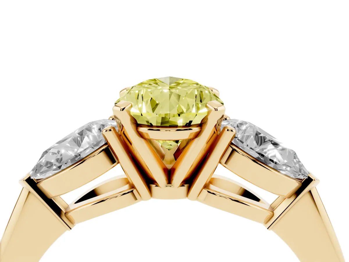 Fancy Yellow Three-Stone Pear Cut Diamond Ring with Pear Side Stones and Four-Prong Setting Yellow gold