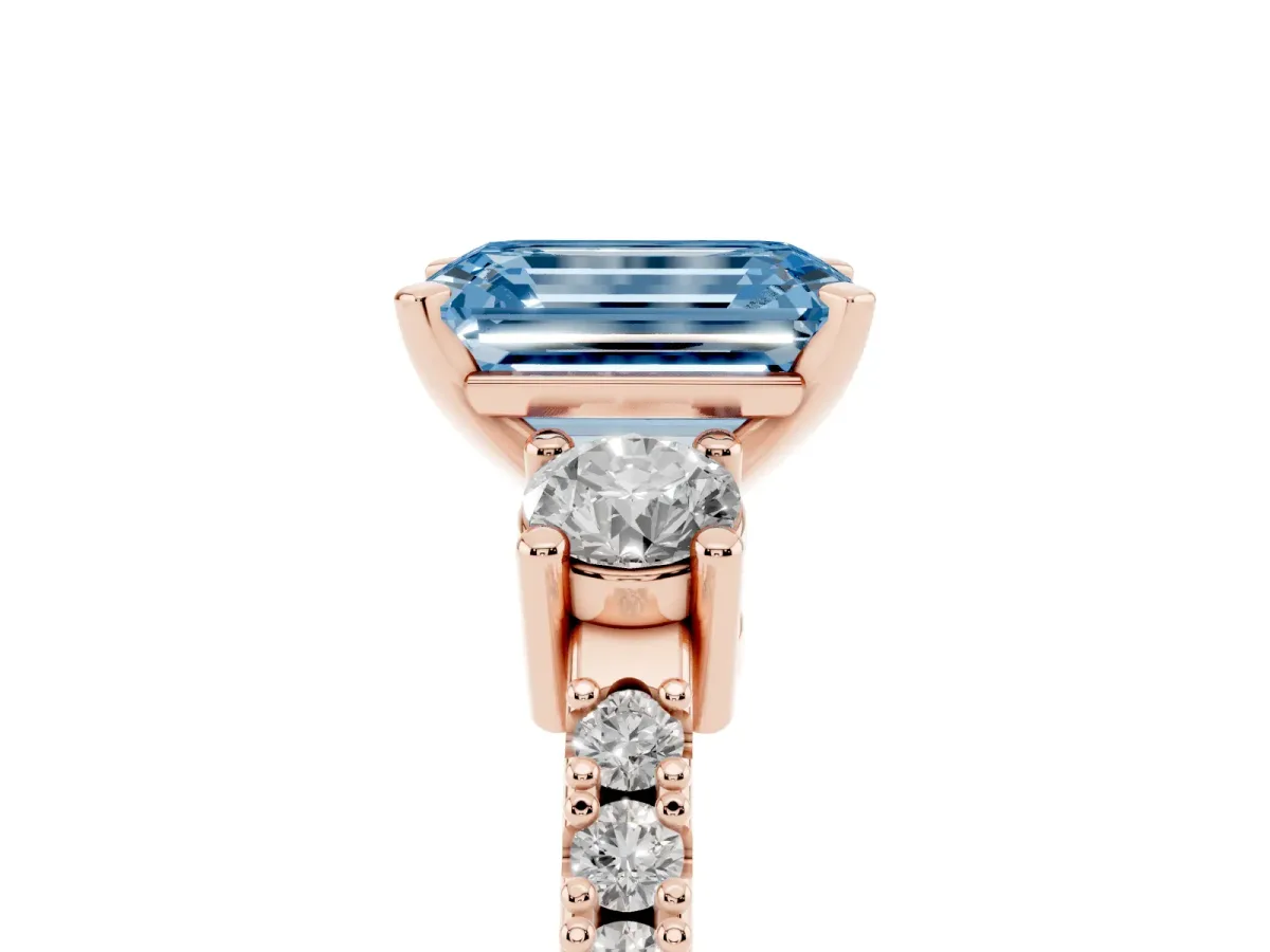 Fancy Blue Emerald Cut Three-Stone Diamond Pavé Band with Prong Setting Rose gold