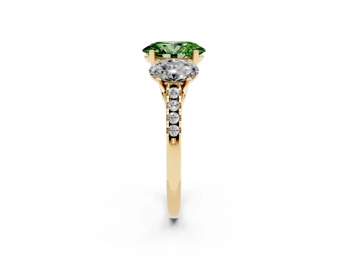 Fancy Green Three-Stone Oval Cut Diamond Ring with Round Pavé Band and Prong Setting Yellow gold