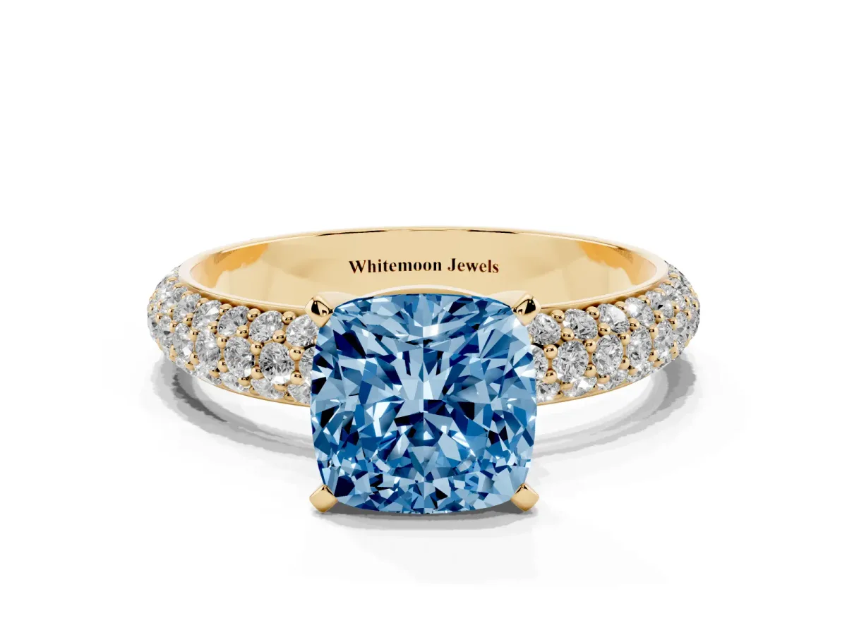 Fancy Blue Cushion Cut Diamond Solitaire Ring with Prong Setting and Pavé Band Yellow gold