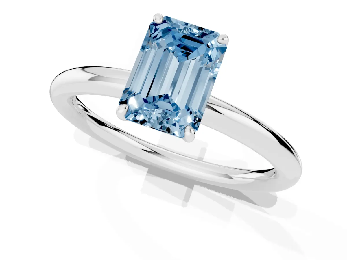 Fancy Blue Emerald Cut Solitaire Diamond Ring with Four-Prong Setting on a Plain Band White gold