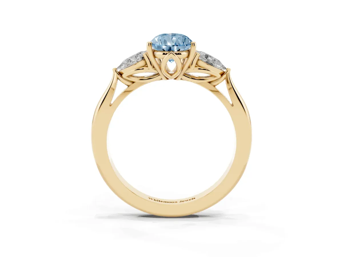 Fancy Blue Three-Stone Pear Cut Brilliant Diamond Solitaire Ring with Tapered Band and Four-Prong Setting Yellow gold