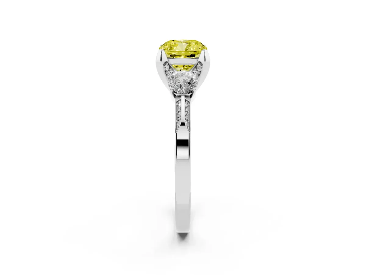 Fancy Yellow Cushion Cut Brilliant Three-Stone Diamond Ring with Pavé Band and Four-Prong Setting Platinum
