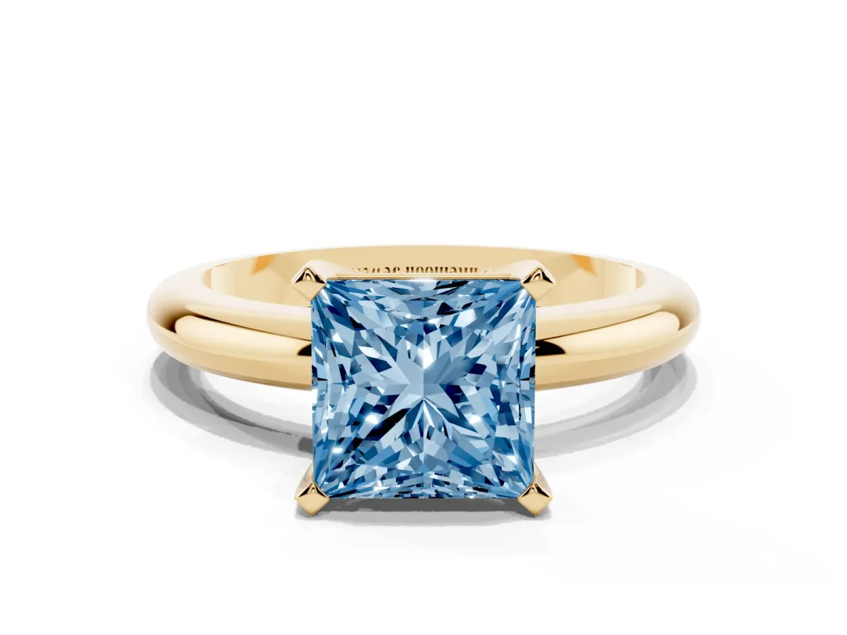 Fancy Blue Princess Cut Diamond Solitaire Engagement Ring with Round Band and Four-Prong Setting Yellow gold