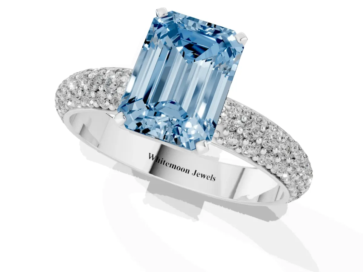 Fancy Blue Emerald Cut Diamond Solitaire Ring with Prong Setting and Pavé Band Silver