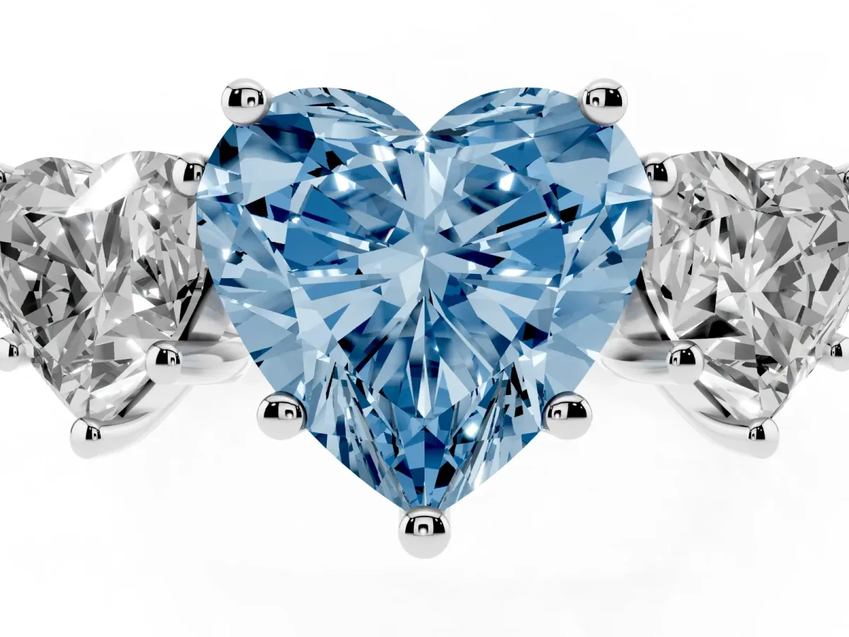 Fancy Blue Three-Stone Heart Cut Diamond Ring with Round Pavé Band and Prong Setting Silver