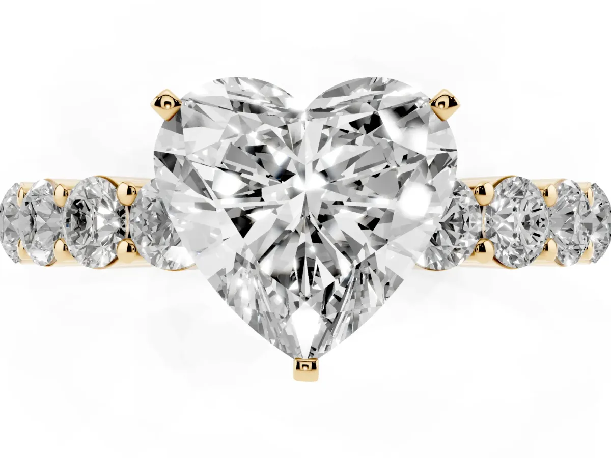 Heart Cut Diamond Solitaire Ring with Shared Prong Round Side Stones Yellow gold