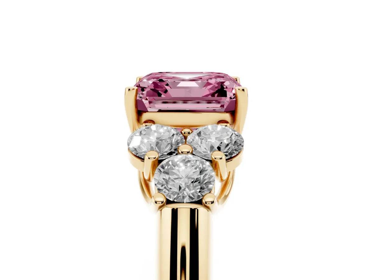 Fancy Pink Asscher Cut Cut Diamond Cluster Ring with Round Accent Stones and Prong Setting on a Classic Band Yellow gold