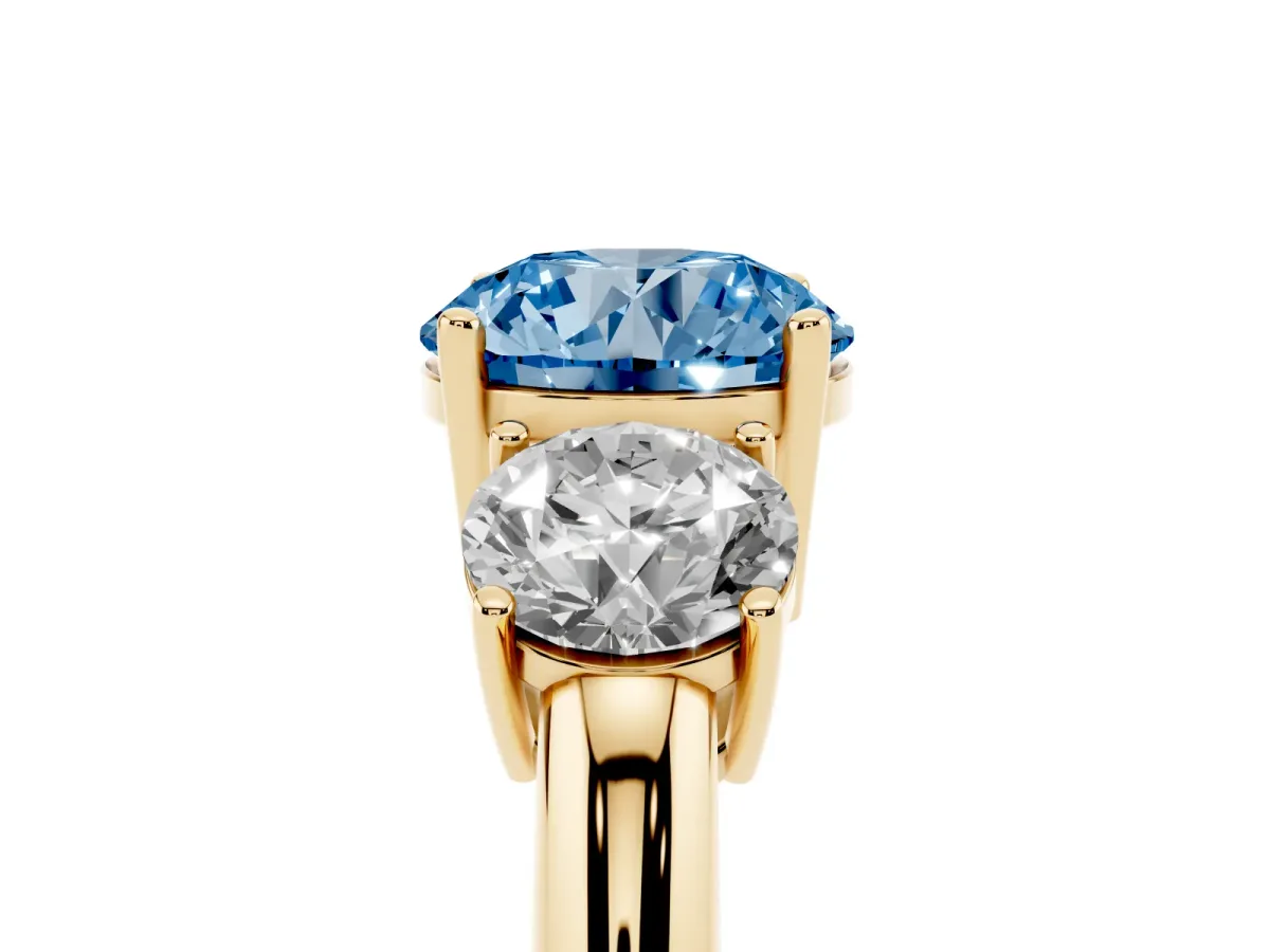 Fancy Blue Three-Stone Round Cut Cut Diamond Engagement Ring with Prong Setting on a White Gold Band Yellow gold