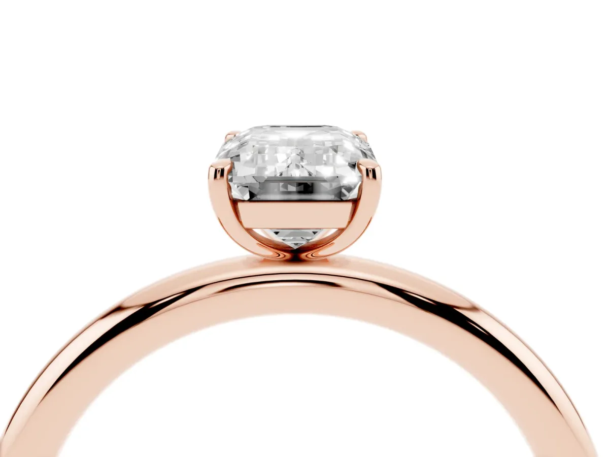 Emerald Cut Solitaire Diamond Ring with Four-Prong Setting on a Plain Band Rose gold