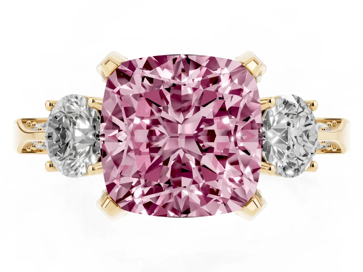 Fancy Pink Cushion Cut Brilliant Three-Stone Diamond Ring with Pavé Band and Four-Prong Setting Yellow gold