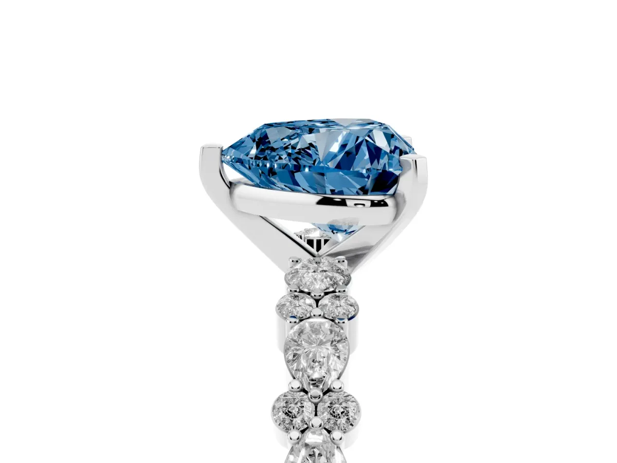 Fancy Blue Heart Cut Diamond Side Stone Solitaire Ring with Round and Four-Prong Setting Silver