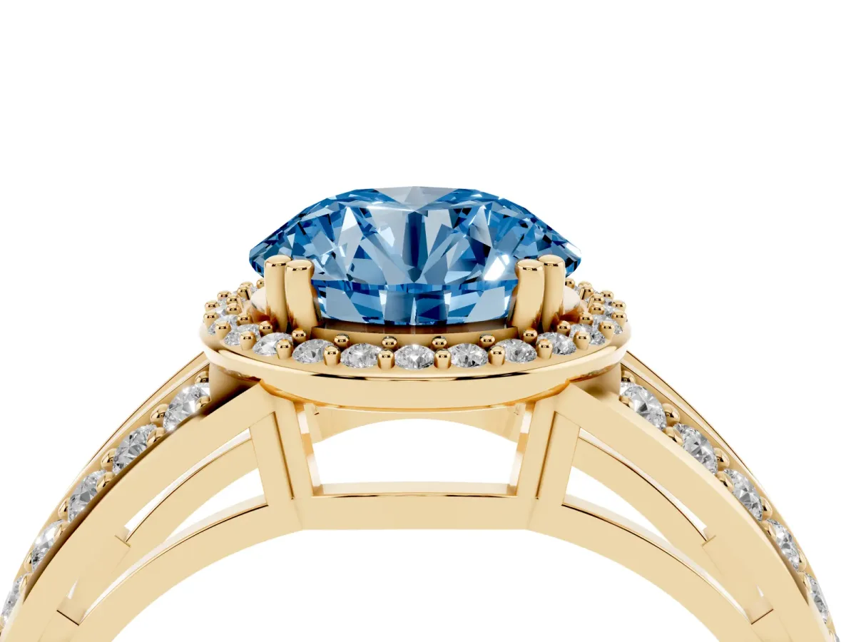 Fancy Blue Round Cut Diamond Halo Ring with Split Shank Pavé Band and Four-Prong Setting Yellow gold